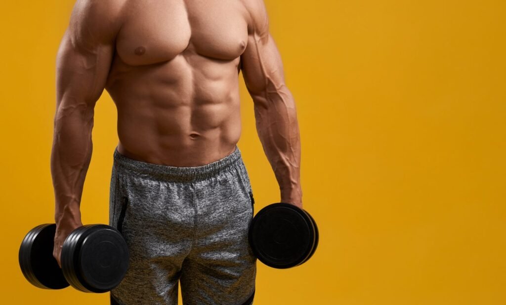 strong young man holding dumbbells